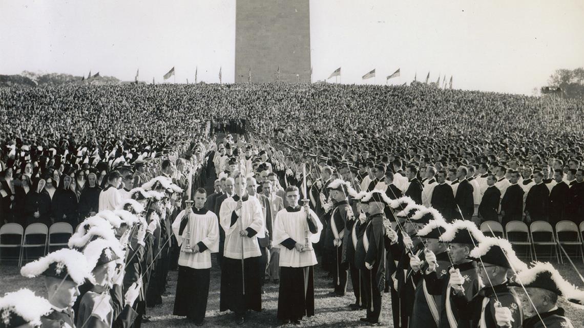 A Fourth Degree honor guard stands at attention